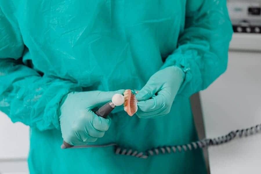 dentist polishing patient dentures